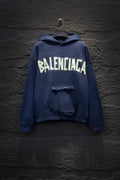 Balenciaga long-sleeve hoodie in dark blue with large white logo on chest