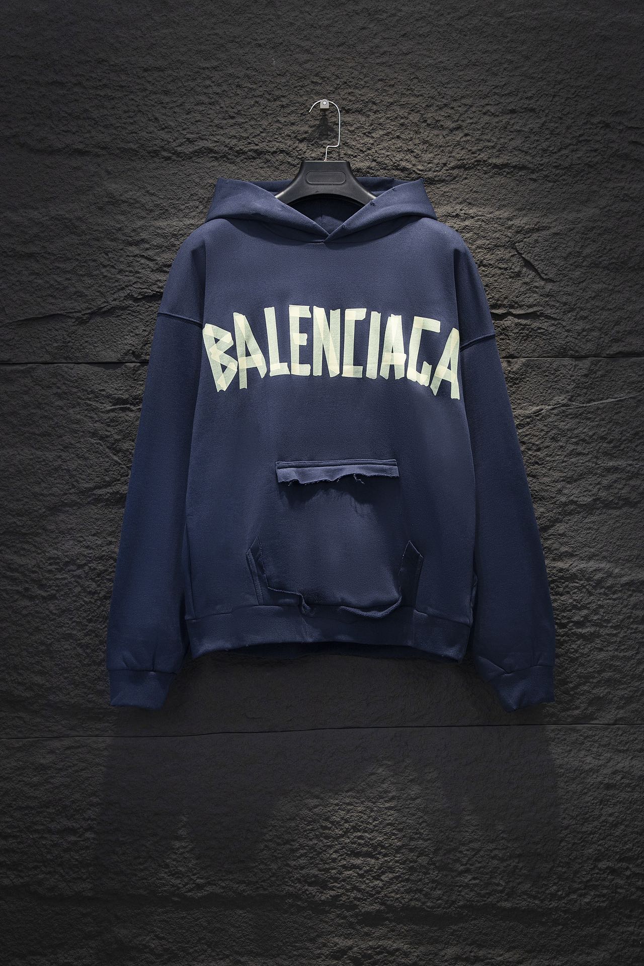 Balenciaga long-sleeve hoodie in dark blue with large white logo on chest