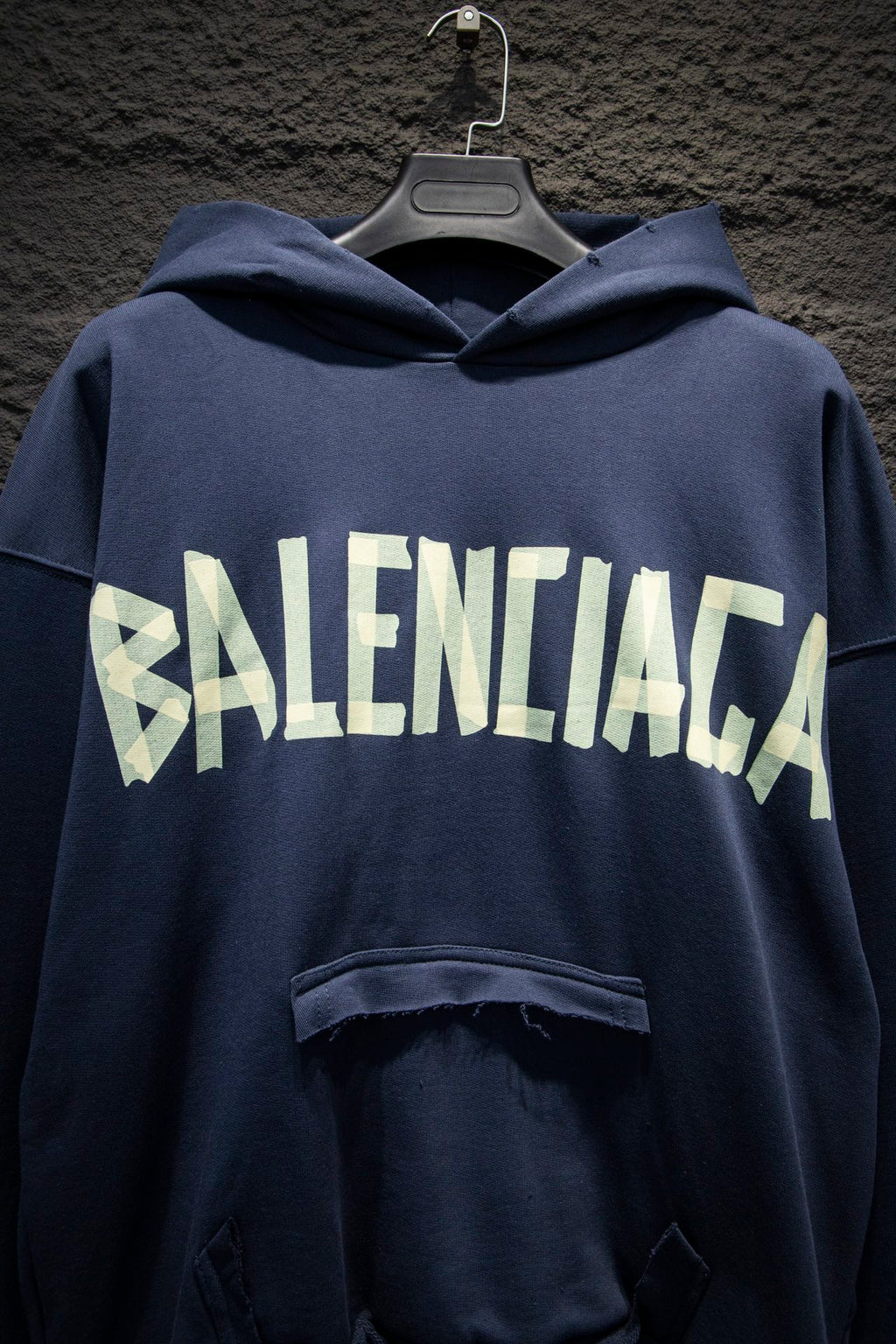 Balenciaga hoodie close-up with white BALENCIAGA logo across chest