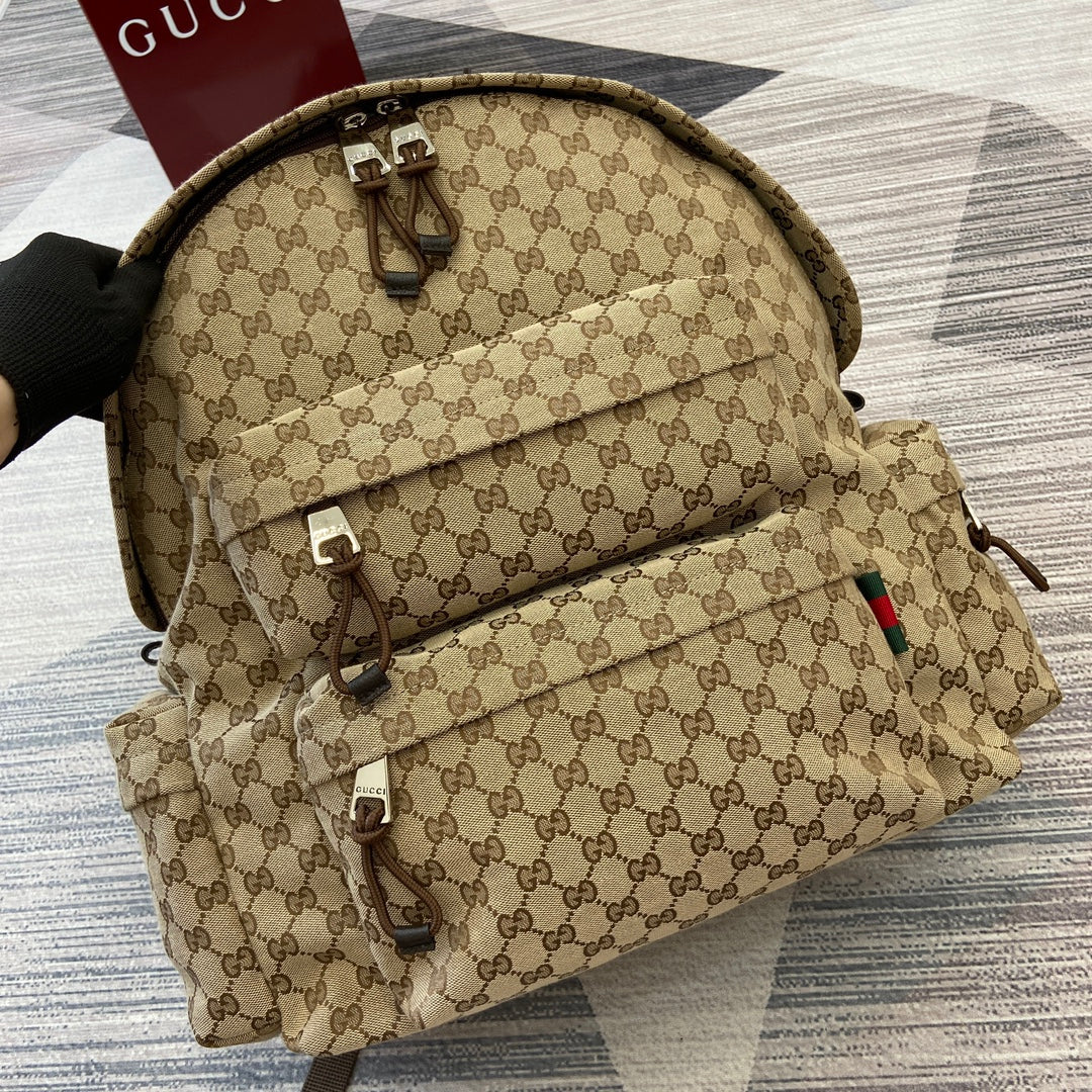 Gucci GG monogram backpack with front flap and adjustable shoulder straps