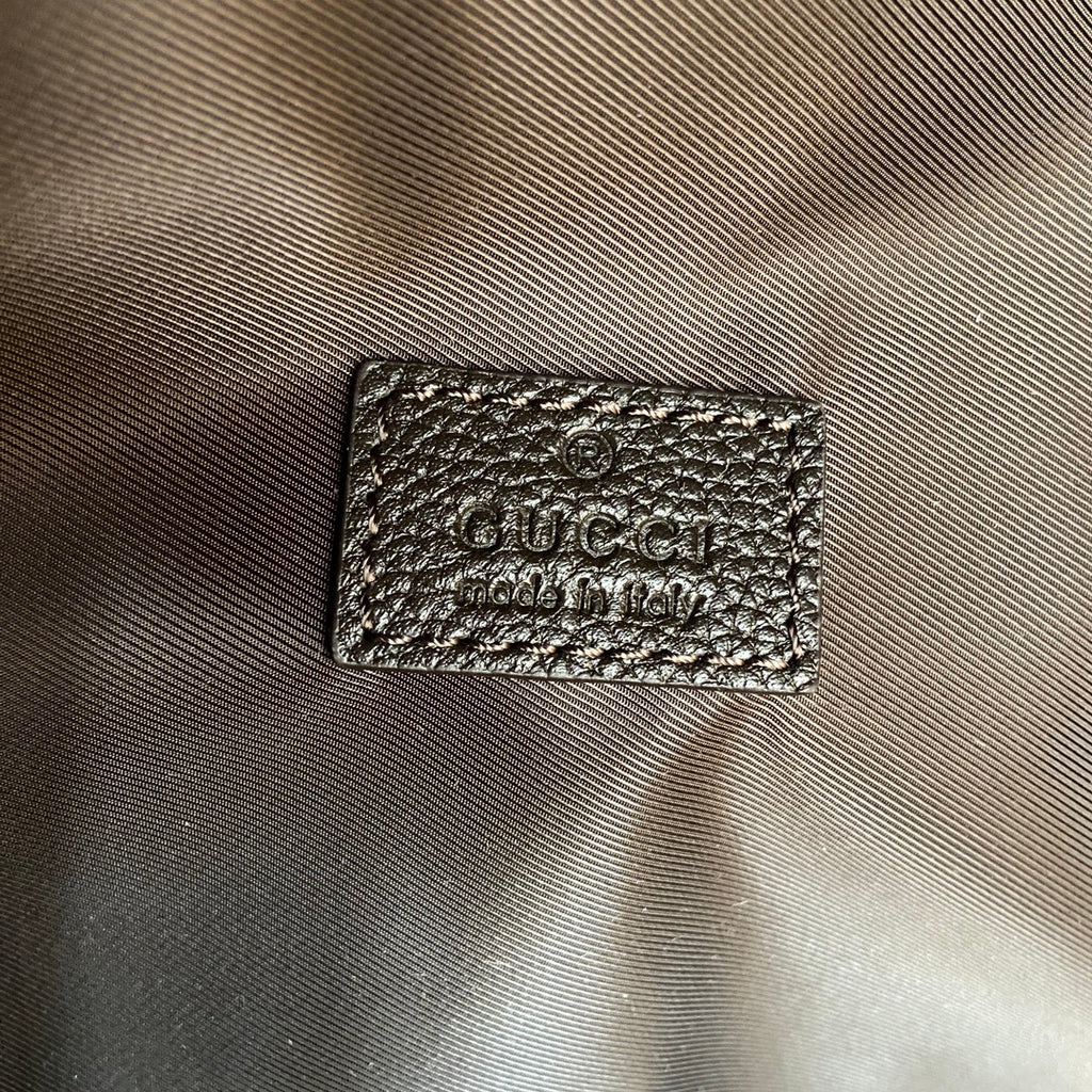 Gucci men’s bag, black leather logo patch on fabric exterior