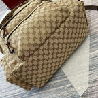 Gucci GG monogram backpack side view with adjustable strap and front pocket