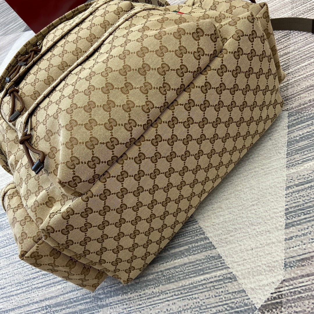 Gucci GG monogram backpack side view with adjustable strap and front pocket
