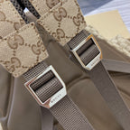 Gucci branded silver buckle straps on GG canvas backpack with dark webbing