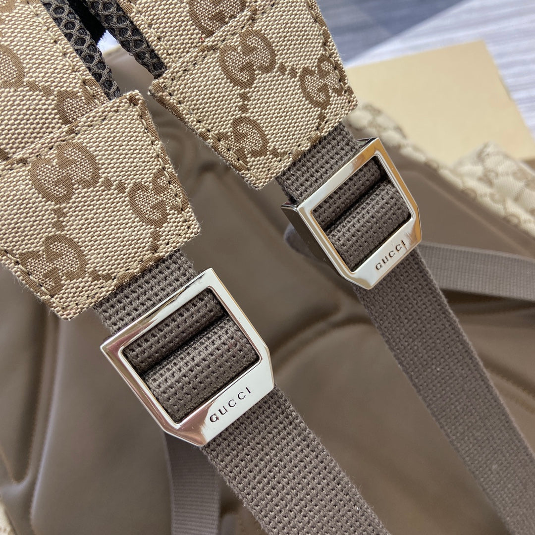 Gucci branded silver buckle straps on GG canvas backpack with dark webbing