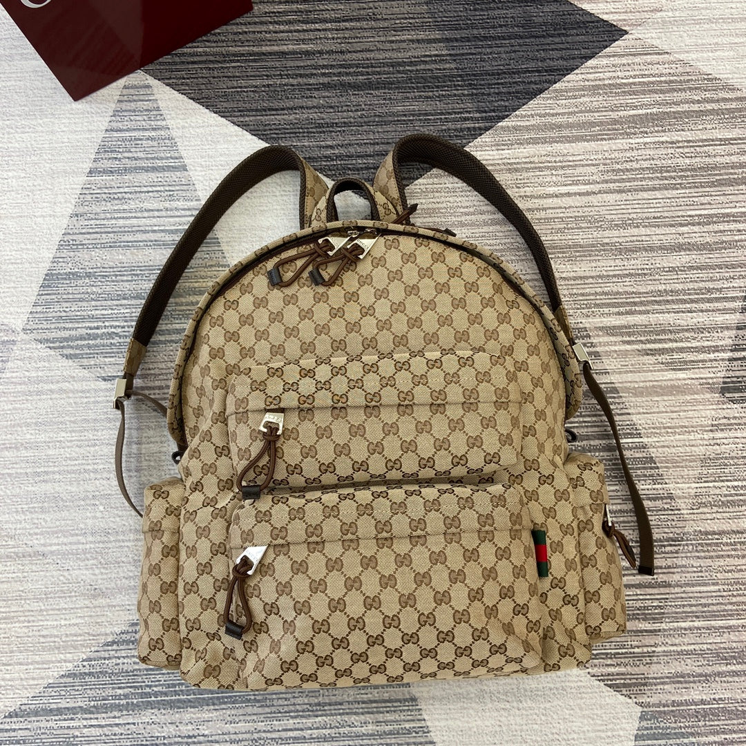 Gucci GG monogram backpack with dual top handles and adjustable shoulder straps