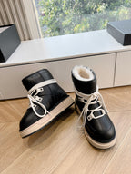 Amiri black high-top sneakers with cream lace-up, beige midsole, side view