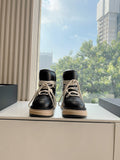 Amiri black high-top sneakers with cream laces and beige rubber sole