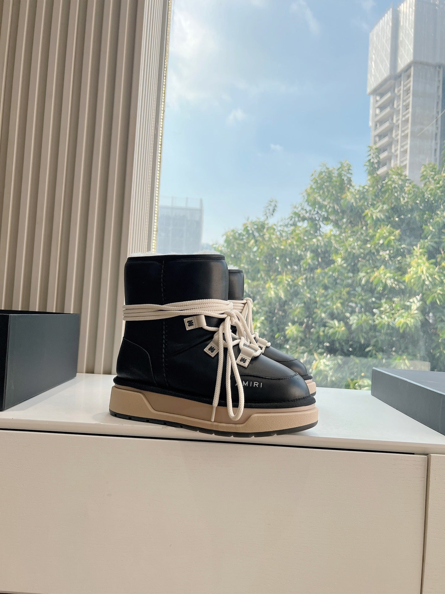 Amiri black high-top boot sneakers with cream laces and beige outsole