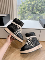 Amiri black high-top sneakers with cream laces and beige platform sole