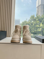 Beige lace-up mid boots with padded collar and light fur lining