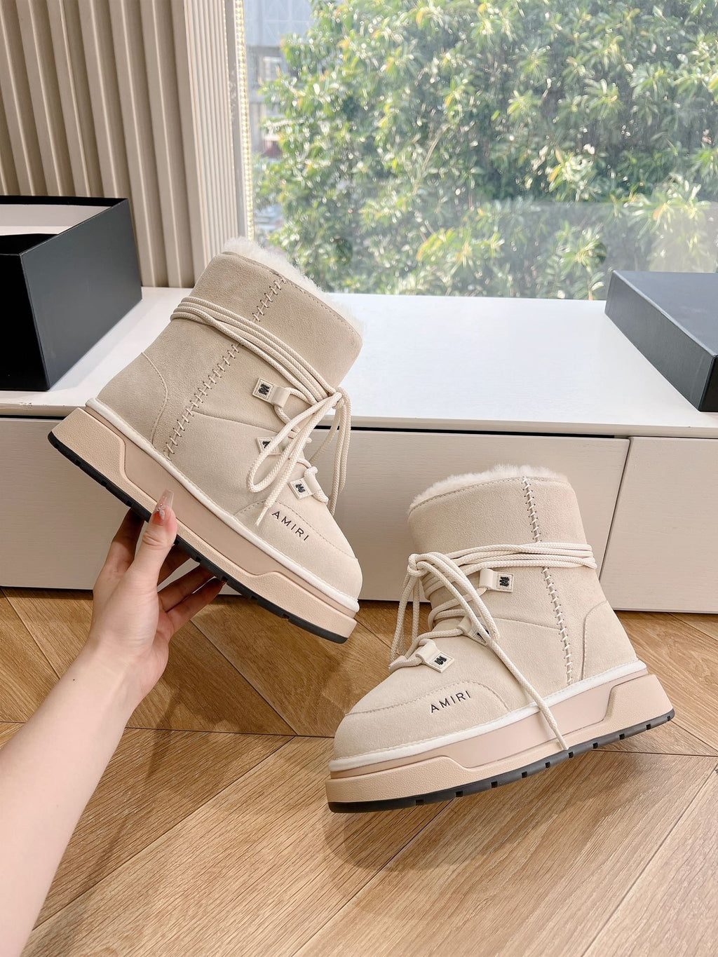 Beige lace-up suede boots with fur trim and AMIRI logo on side