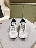 White lace-up sneakers with Dior logo, black heel panels, perforated mesh uppers