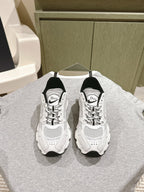 White lace-up sneakers with Dior logo, black heel panels, perforated mesh uppers