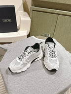 White lace-up sneakers with Dior logo tongue, black heel trim, chunky platform sole