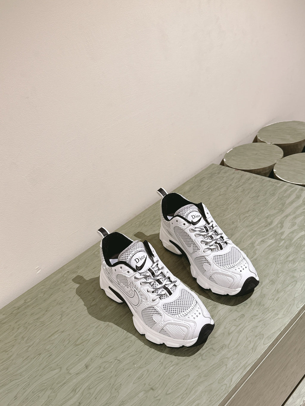 White lace-up sneakers with Dior logo, black heel tab, padded collar