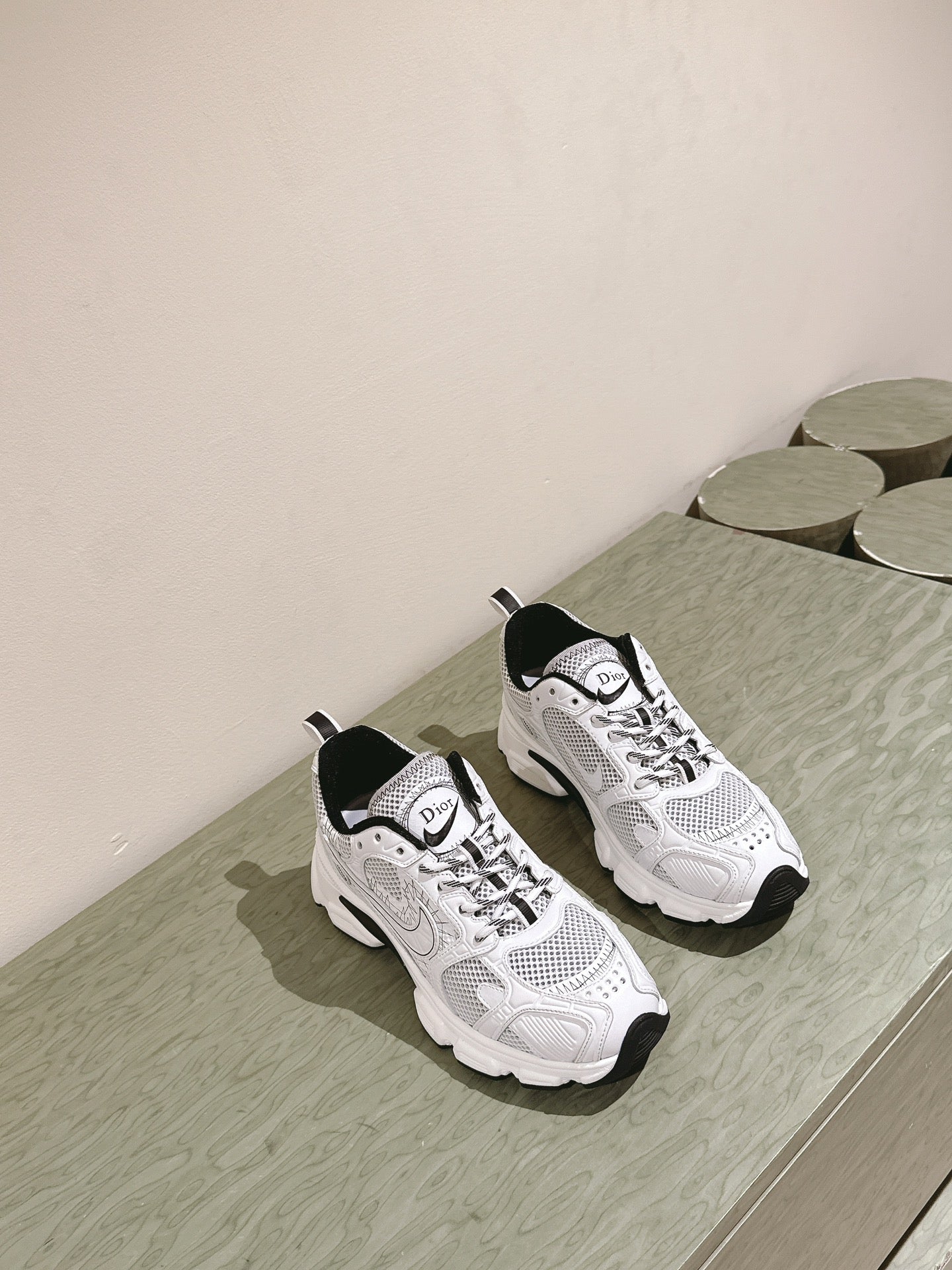 White lace-up sneakers with Dior logo, black heel tab, padded collar