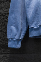 Light blue hoodie sleeve with ribbed cuff and side panel seam detail