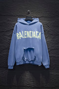 Light blue Balenciaga long-sleeve hoodie with large front graphic and open chest pouch detail