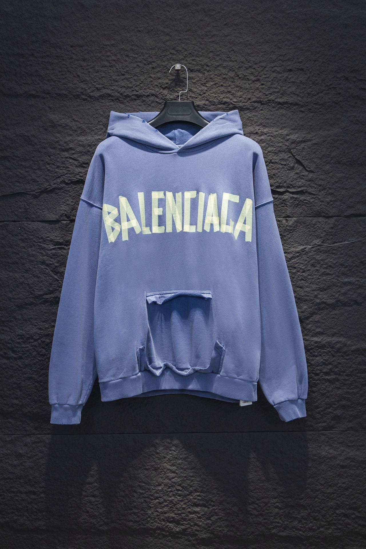 Light blue Balenciaga long-sleeve hoodie with large front graphic and open chest pouch detail