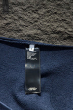 Blue sweatshirt fabric and interior neck label with brand text