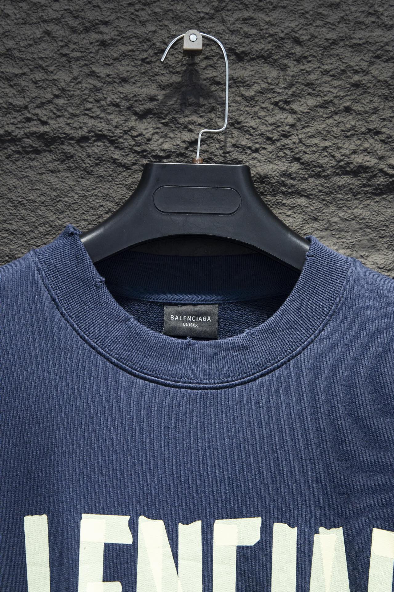 Blue sweatshirt neckline and crew collar with hang tag