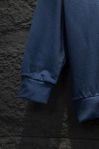 Blue sweatshirt with ribbed sleeve cuff and relaxed fit