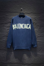 Blue sweatshirt with white Balenciaga-style graphic logo