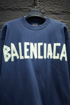 Blue sweatshirt with large white Balenciaga logo across chest