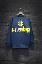 Blue sweatshirt with yellow Balenciaga-style logo text on back