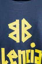 Blue sweatshirt with close-up yellow graphic letters and logo