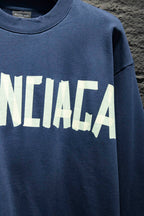 Blue sweatshirt with partial white Balenciaga logo lettering