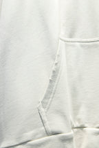 White hoodie fabric with stitched hood seam and drawstring opening