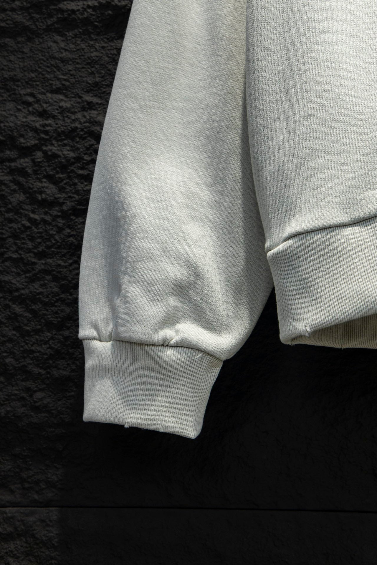 White hoodie sleeve cuffs and hem with ribbed knit detailing