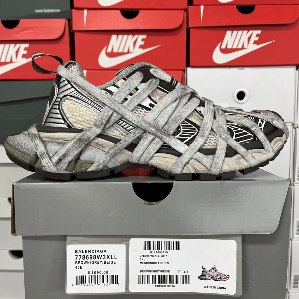 Gray unisex sneakers with black panel inserts and crisscross lace pattern