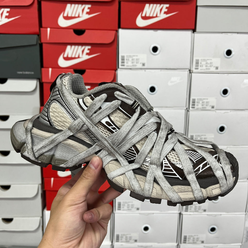 Gray unisex sneakers front view with lace cross pattern and textured toe cap