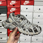 Gray unisex sneakers front view with lace cross pattern and textured toe cap