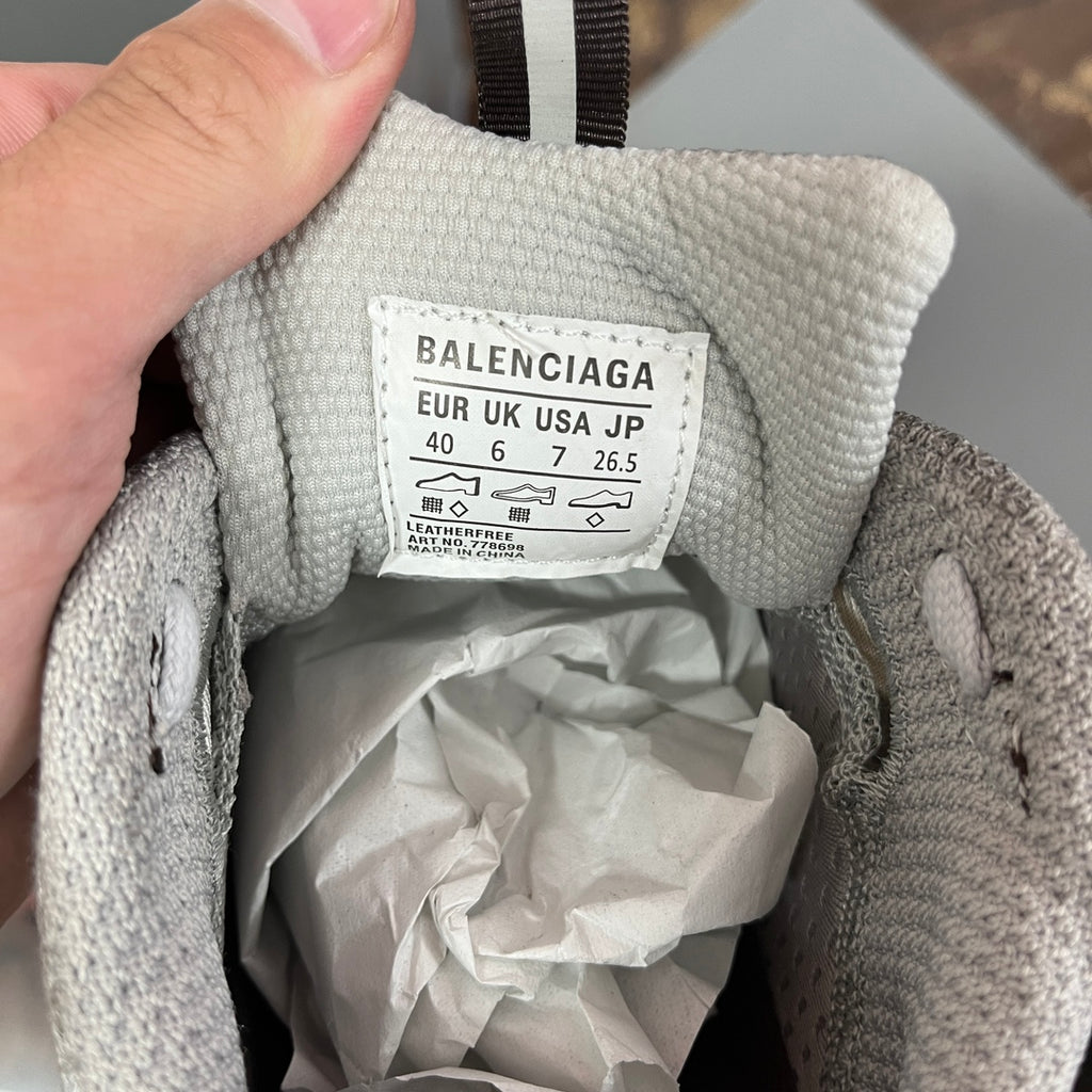 Gray sneaker interior label with Balenciaga branding and size details