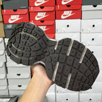 Gray sneaker outsole with deep tread and multiple rubber traction pods