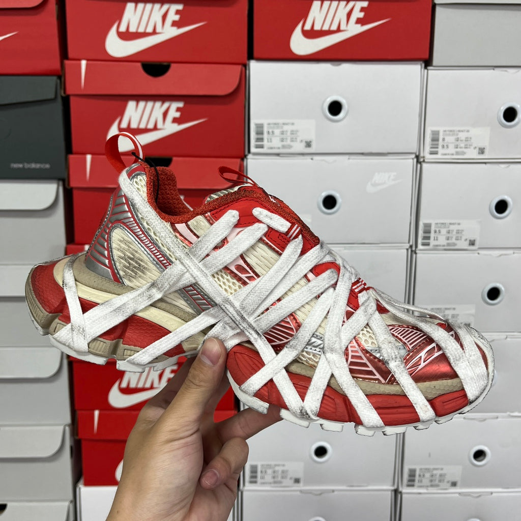 Unisex sneaker angled view with red-and-beige upper and white laces