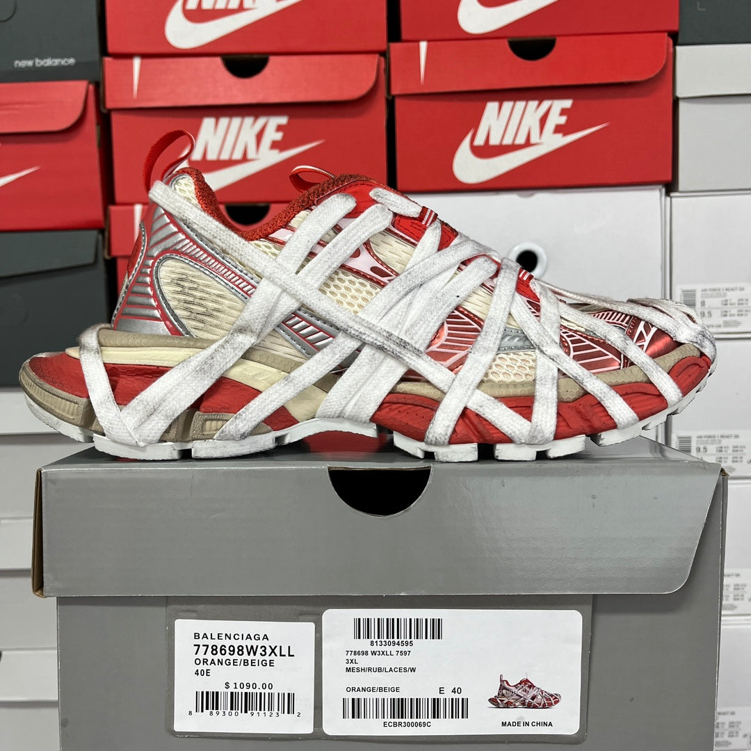 Unisex sneaker on box with red and beige striped panels, white laces
