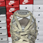 Back of lace-up sneaker with mesh lining, padded collar, and logo tab.