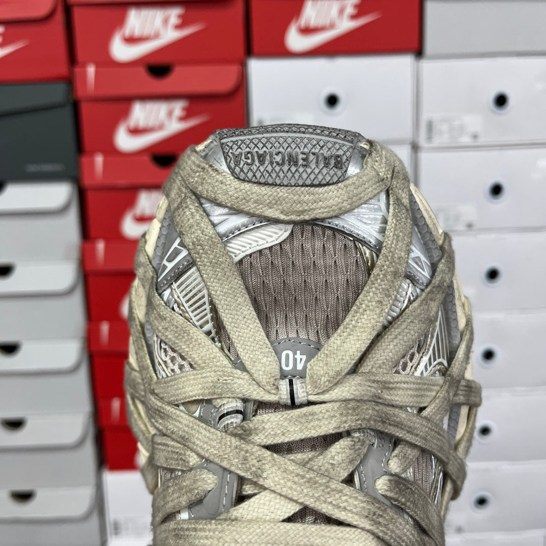 Back of lace-up sneaker with mesh lining, padded collar, and logo tab.
