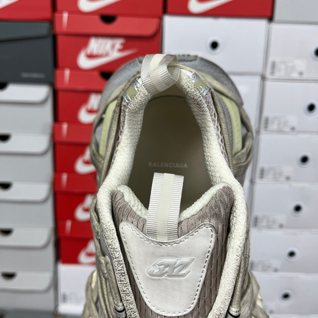 Sneaker heel interior with fabric lining and Balenciaga logo patch.