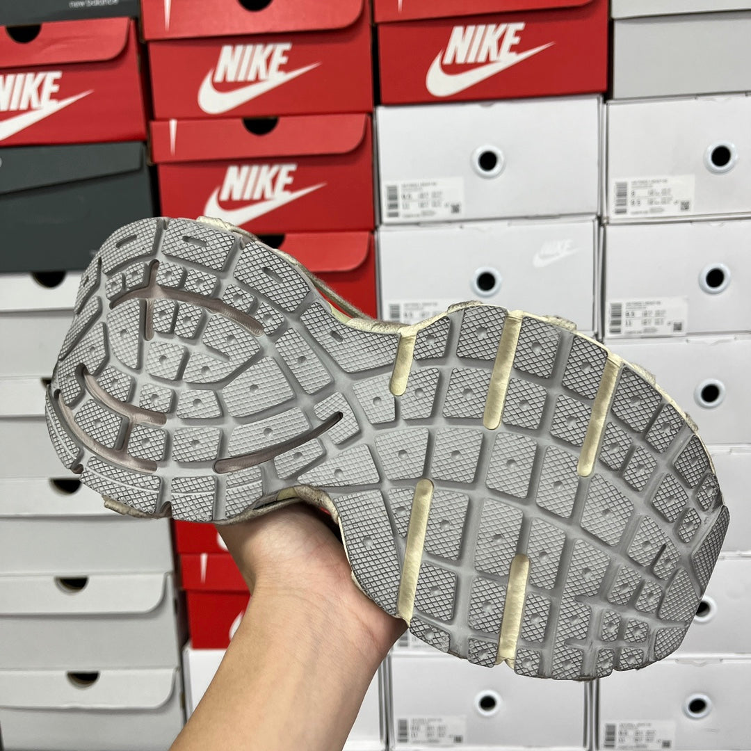 Shoe outsole with grid traction pattern and molded midsole details.