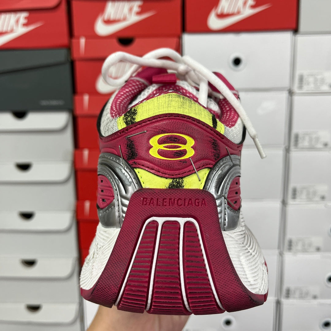 Balenciaga sneaker heel with maroon panel, yellow trim, and ribbed sole