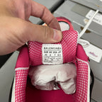 Maroon sneaker heel label with white Balenciaga sizing tag and white laces