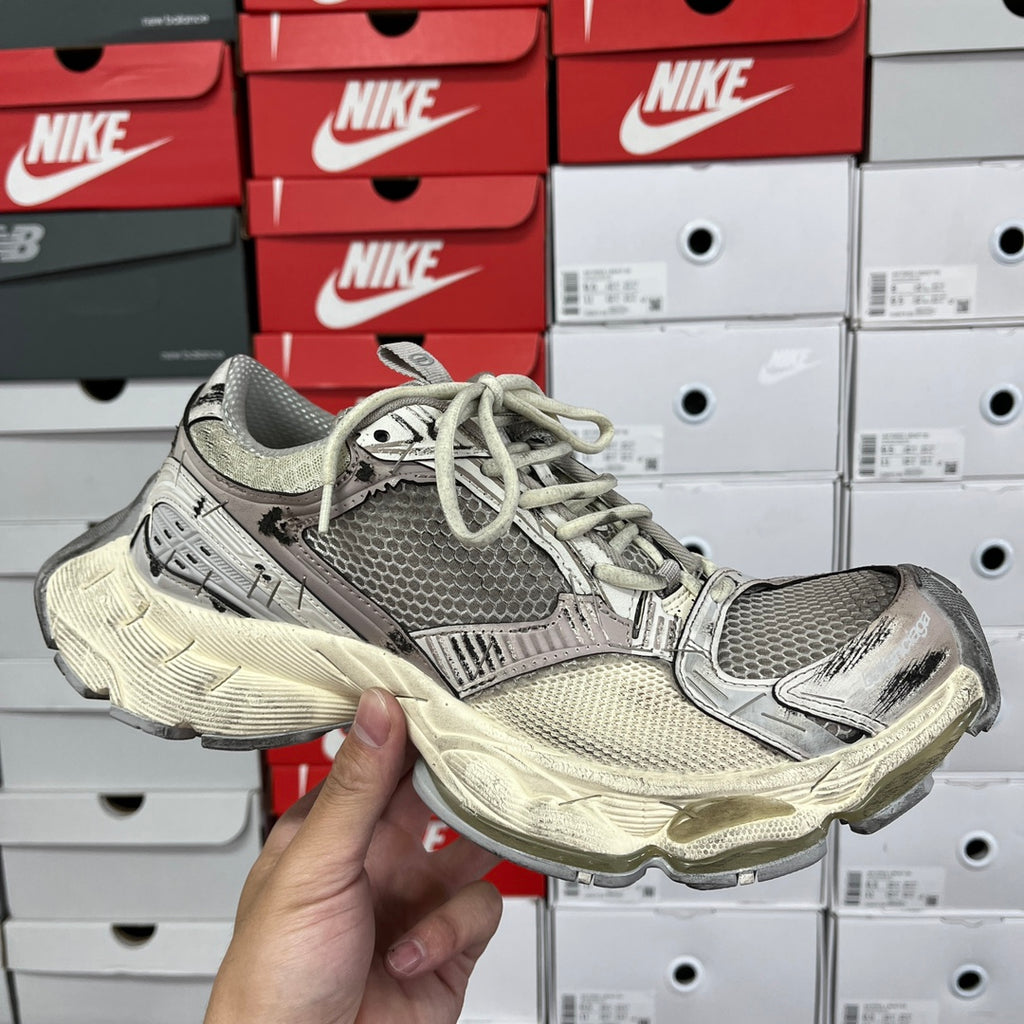 Balenciaga unisex running shoes with gray mesh upper, lace-up front, off-white sole