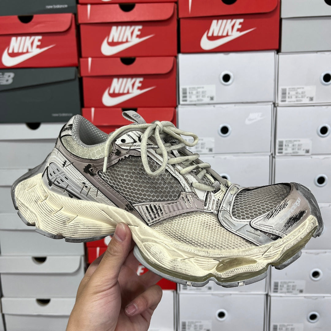 Balenciaga unisex running shoes with gray mesh upper, lace-up front, off-white sole