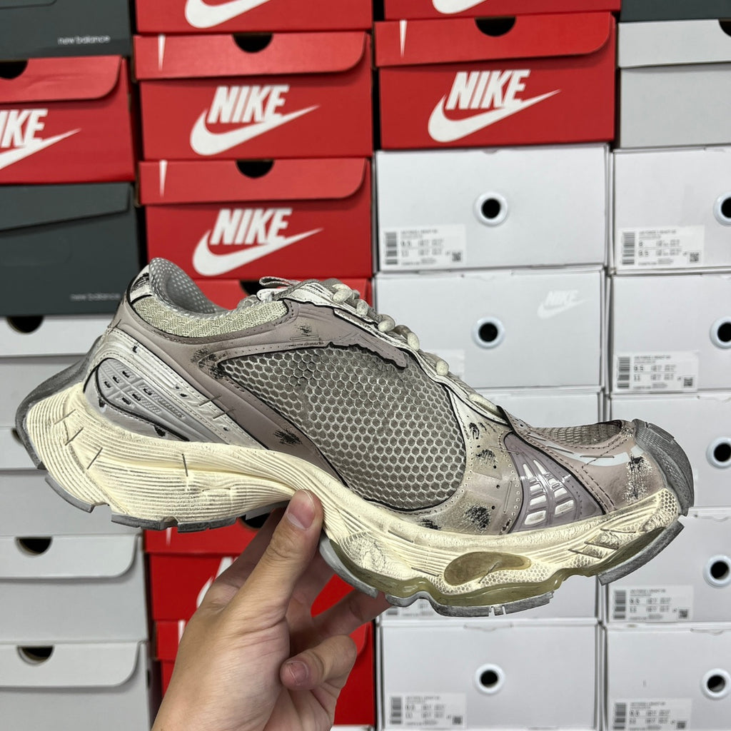 Balenciaga unisex running shoes, front side view with gray mesh upper and off-white midsole
